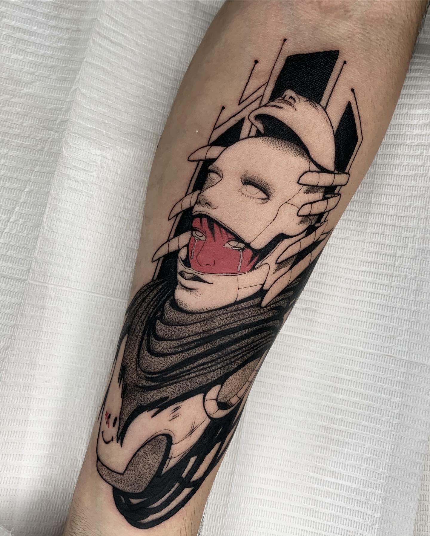 Intricate cyberpunk tattoo featuring a masked figure with mechanical hands and red accents